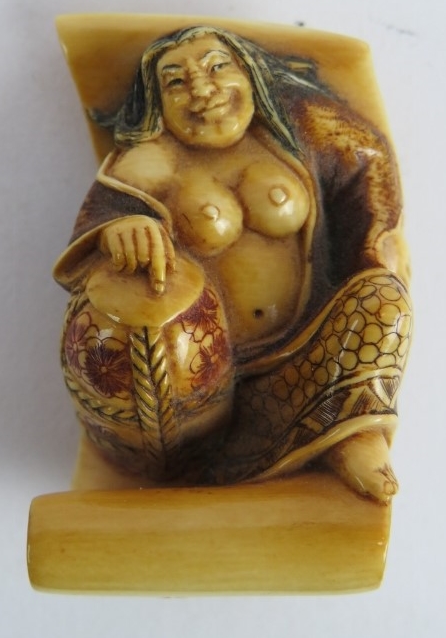 A finely carved Japanese ivory Netsuke, Meiji period, of a semi nude female on a scroll decorated in - Image 4 of 4