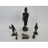 A bronze figure of a standing buddha, four antique bronze Indian Votive figures and a similar bass