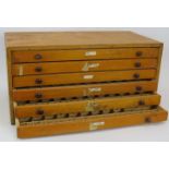A vintage beech wood printers/collectors cabinet of six drawers, each divided into 60 sections. 50cm
