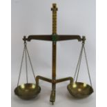 A pair of 1950's brass balance scales by H.M. Stanley Ltd., London. To weigh up to 50 oz Troy.