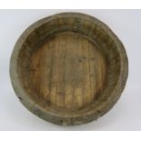 A large coopered oak dairy bowl or dough trough with wire hoops. Diameter: 68cm. Condition report: