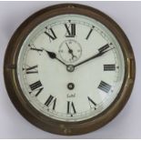 A Sestrel brass ships clock with painted dial and bevelled glass case. Diameter 19cm. Key present.