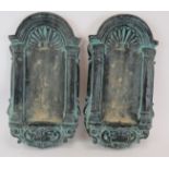 A pair of reconstituted stone wall niche mounts finished in a Verdigris style paint. Height: 51cm.