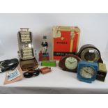 A mixed lot including three vintage clocks, a cast iron Uncle Sam mechanical money box, a vintage