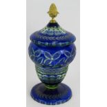 An antique Bohemian flash cut blue glass covered jar with later Ormulu finial. Height 25cm.