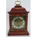 An early 20th century Georgian style bracket clock with red lacquer and gilt chinoiserie decoration.