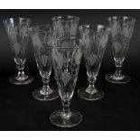 A set of six late Georgian engraved dwarf ale glasses each decorated with hops and barley and having
