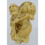 A well carved Japanese Meiji period ivory Netsuke of a man carrying a gourd, signed to foot.