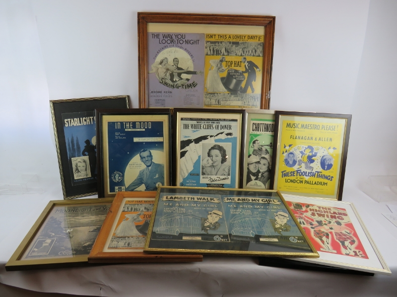 A large collection of mainly framed 1930's and 1940's sheet music covers including Flanagan & Allan,