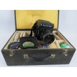 A Mamiya RB67 Pro 5x7 format camera with a 65mm f4.5 Mamiya Sekor lens. Wooden carrying case and