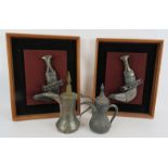 Two framed and mounted Omani Khanjar daggers with white metal decoration and two eastern Dallah