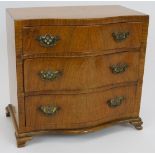 A good quality miniature serpentine fronted chest of drawers, circa 1920s stamped 'H. Uphill Wilton'