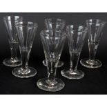 A set of six late 19th century conical dram glasses with gadget mark to base. Height 9cm.