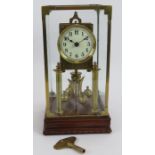 An antique 400 day mantel clock under a bespoke brass glazed case. Movement No 57174. Key and