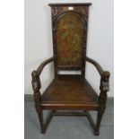 An Arts & Crafts oak hall chair, in the 17th century Spanish taste, the backrest ornately