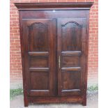 An 18th century French cherrywood armoire of excellent colour with fielded panels to doors, brass