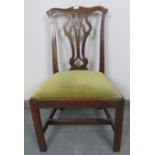 A Georgian oak occasional chair with pierced backsplat and drop in seat pad upholstered in pale