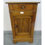 A 19th century Continental fruitwood bedside cabinet with single drawer, over a cupboard with fitted