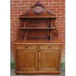 A Victorian walnut chiffonier sideboard with carved and shelved back, housing two short drawers over