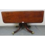 A 19th century walnut Pembroke table with single drawer to one side and dummy drawer to the other,