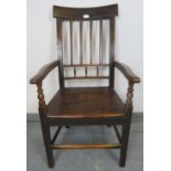 A Georgian oak country made elbow chair with turned spindles, on square supports with stretchers.