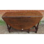 A 19th century oak oval gateleg table with single drawer, on turned and block supports with