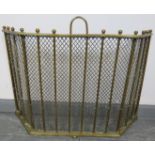 An Edwardian three section folding brass and wire mesh fireguard with ball finials. Condition