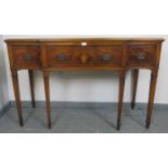 An Edwardian Regency revival mahogany breakfront sideboard strung with ebony, housing three