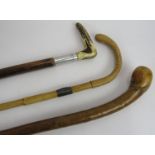 A bulbous headed chestnut walking stick, an antler handled walking stick and a vintage walking