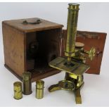 A mid 19th century brass microscope by Moritz Pillischer London No 584, with spare lenses and