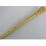 A 19th century marine ivory walking cane consisting of a hexagonal knob and single piece whalebone