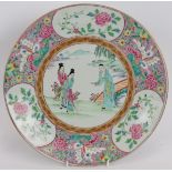 A 20th century Chinese porcelain charger with enamelled Famille Rose pattern. Signed and incised