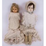Two 19th century dolls in period dress, one with a wax face, both unmarked. Tallest 48cm.