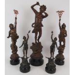 An antique French bronzed spelter figure of Pan (56cm) and two pairs of similar spelter figures. (