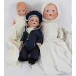 Two antique Bisque headed baby dolls in period gowns, one by Armande Marseille and one marked Baby