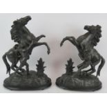 A pair of hollow cast spelter Marley horses in black finish. Tallest 47cm. (pr). Condition report: