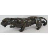 A large bronzed figure of a prowling panther in Art Deco style. Length 54cm. Condition report: No