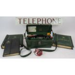 A glass 47 SSG red telephone box sign, a Pye TMC Linesmans 704 telephone and three GPO manuals. (5).