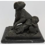 A bronze figure of a dog and sleeping child mounted on a black marble plinth. Signed B.M.18.