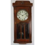 An International Time Recording Co striking wall clock in later mahogany case. Height 82cm.