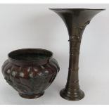 A large Japanese bronze vase of trumpet form with bird and bamboo relief, signed to base, and a