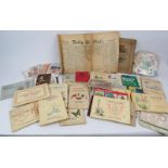 A quantity of approximately 16 cigarette card albums, various pamphlets, vintage postcards, stamps
