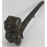 An ethnic African figural bronze pipe possibly from Benin Nigeria, the bowl being in the form of a