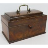 A walnut Georgian inlaid tea caddy with ebony and boxwood stringing and later green baize lining.