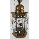 A vintage Persian style gilt hall lantern with floral swag decoration. Height 52cm. Condition
