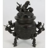 A 19th century Chinese bronze Koro incense burner with dragon handles, Fo dog finial and human