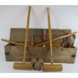 A vintage Atlas croquet set in wooden box, comprising four mallets, 3 balls, 4 hoops, colour peg and