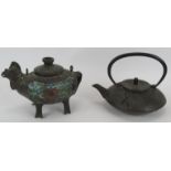 An iron Japanese tea pot decorated with relief patterns and a Chinese bronze tea pot in the form