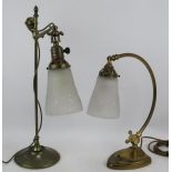 A Christopher Wray Art Nouveau style desk lamp with moulded glass shade and a similar brass rise and