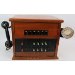 A 1960s mahogany cased GEC telephone switchboard. 37cm x 31cm x 30cm. Condition report: Cable